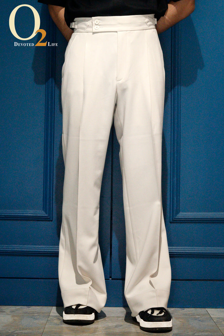 High-waisted, wide-leg pleated pant with side-tab adjusters. Pair it with a sleek black shirt and standout sneakers for the perfect modern statement. - o2fashions